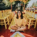 woman sitting on red floor